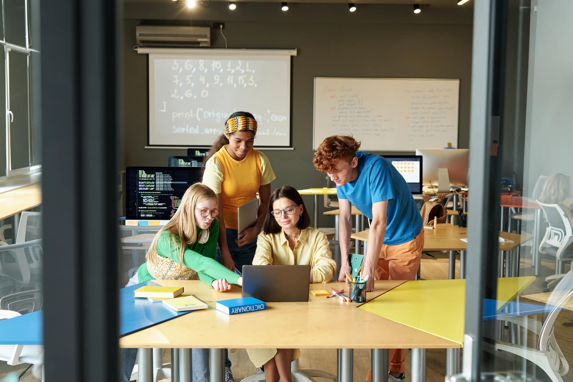 Teacher teaching information technology to students